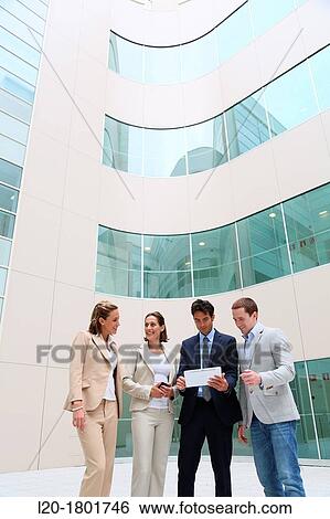 Businesspeople using digital tablet View Large Photo Image Stock Photograph - Businesspeople using digital tablet. Fotosearch