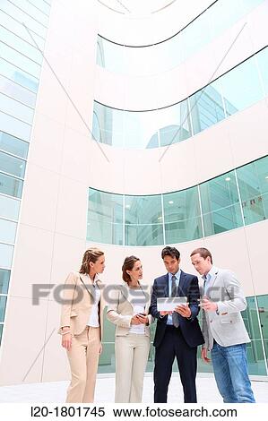 Businesspeople using digital tablet View Large Photo Image Stock Photography - Businesspeople using digital tablet. Fotosearch