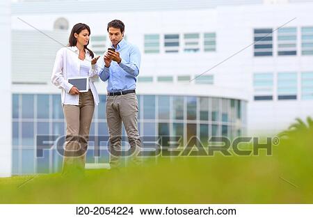 Businesswoman and businessman in business center. San Sebastian Technology Park. Donostia. Gipuzkoa. Basque Country. Spain. View Large Photo Image Picture - Businesswoman and businessman in business center. San Sebastian Technology Park. Donostia. Gipuzkoa. Basque Country. Spain.. Fotosearch
