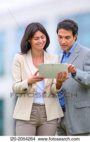 Businesswoman and businessman in business center. San Sebastian Technology Park. Donostia. Gipuzkoa. Basque Country. Spain. View Large Photo Image Picture - Businesswoman and businessman in business center. San Sebastian Technology Park. Donostia. Gipuzkoa. Basque Country. Spain.. Fotosearch