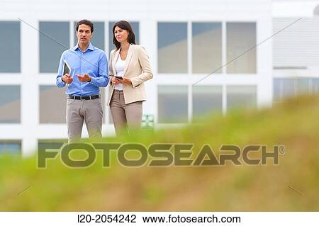 Businesswoman and businessman in business center. San Sebastian Technology Park. Donostia. Gipuzkoa. Basque Country. Spain. View Large Photo Image Stock Image - Businesswoman and businessman in business center. San Sebastian Technology Park. Donostia. Gipuzkoa. Basque Country. Spain.. Fotosearch