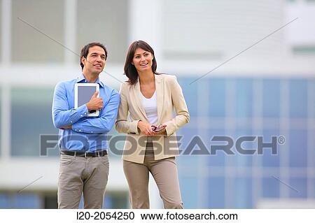Stock Image - Businesswoman and businessman in business center. San Sebastian Technology Park. Donostia. Gipuzkoa. Basque Country. Spain.. Fotosearch