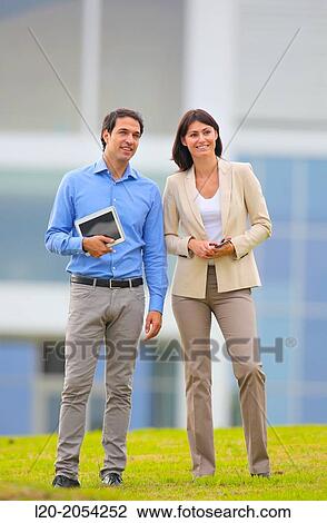 Businesswoman and businessman in business center. San Sebastian Technology Park. Donostia. Gipuzkoa. Basque Country. Spain. View Large Photo Image Stock Image - Businesswoman and businessman in business center. San Sebastian Technology Park. Donostia. Gipuzkoa. Basque Country. Spain.. Fotosearch