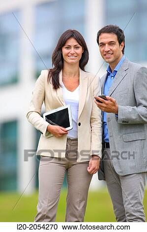 Businesswoman and businessman in business center. San Sebastian Technology Park. Donostia. Gipuzkoa. Basque Country. Spain. View Large Photo Image Stock Image - Businesswoman and businessman in business center. San Sebastian Technology Park. Donostia. Gipuzkoa. Basque Country. Spain.. Fotosearch