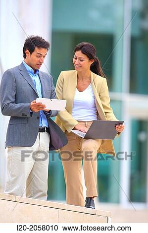 Businesswoman and businessman in business center. San Sebastian Technology Park. Donostia. Gipuzkoa. Basque Country. Spain. View Large Photo Image Stock Image - Businesswoman and businessman in business center. San Sebastian Technology Park. Donostia. Gipuzkoa. Basque Country. Spain.. Fotosearch