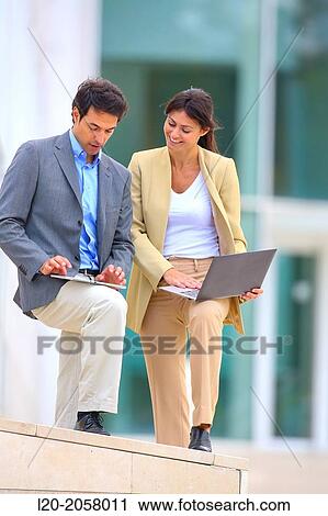 Businesswoman and businessman in business center. San Sebastian Technology Park. Donostia. Gipuzkoa. Basque Country. Spain. View Large Photo Image Stock Image - Businesswoman and businessman in business center. San Sebastian Technology Park. Donostia. Gipuzkoa. Basque Country. Spain.. Fotosearch