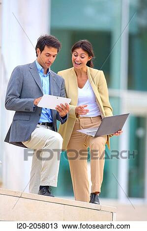 Businesswoman and businessman in business center. San Sebastian Technology Park. Donostia. Gipuzkoa. Basque Country. Spain. View Large Photo Image Stock Image - Businesswoman and businessman in business center. San Sebastian Technology Park. Donostia. Gipuzkoa. Basque Country. Spain.. Fotosearch