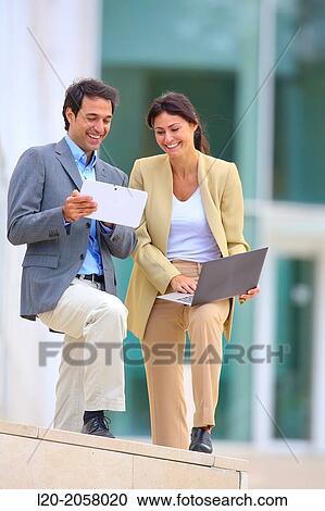 Businesswoman and businessman in business center. San Sebastian Technology Park. Donostia. Gipuzkoa. Basque Country. Spain. View Large Photo Image Stock Image - Businesswoman and businessman in business center. San Sebastian Technology Park. Donostia. Gipuzkoa. Basque Country. Spain.. Fotosearch