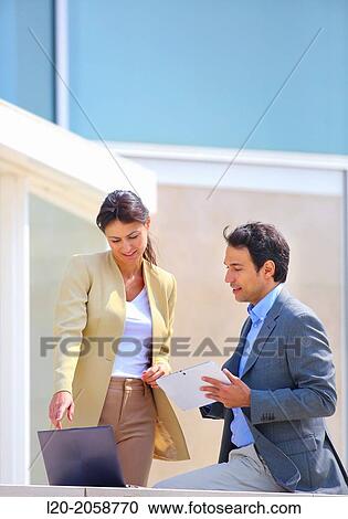Businesswoman and businessman in business center. San Sebastian Technology Park. Donostia. Gipuzkoa. Basque Country. Spain. View Large Photo Image Stock Image - Businesswoman and businessman in business center. San Sebastian Technology Park. Donostia. Gipuzkoa. Basque Country. Spain.. Fotosearch