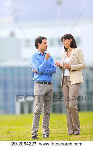 Businesswoman and businessman in business center. San Sebastian Technology Park. Donostia. Gipuzkoa. Basque Country. Spain. View Large Photo Image Stock Photo - Businesswoman and businessman in business center. San Sebastian Technology Park. Donostia. Gipuzkoa. Basque Country. Spain.. Fotosearch