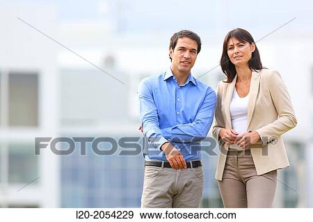 Stock Photo - Businesswoman and businessman in business center. San Sebastian Technology Park. Donostia. Gipuzkoa. Basque Country. Spain.. Fotosearch