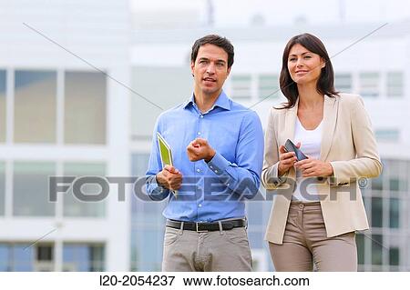 Stock Photo - Businesswoman and businessman in business center. San Sebastian Technology Park. Donostia. Gipuzkoa. Basque Country. Spain.. Fotosearch