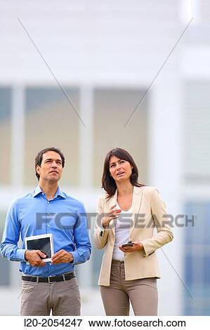 Businesswoman and businessman in business center. San Sebastian Technology Park. Donostia. Gipuzkoa. Basque Country. Spain. View Large Photo Image Stock Photo - Businesswoman and businessman in business center. San Sebastian Technology Park. Donostia. Gipuzkoa. Basque Country. Spain.. Fotosearch
