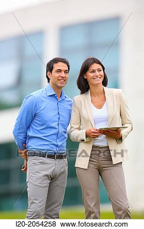 Businesswoman and businessman in business center. San Sebastian Technology Park. Donostia. Gipuzkoa. Basque Country. Spain. View Large Photo Image Stock Photo - Businesswoman and businessman in business center. San Sebastian Technology Park. Donostia. Gipuzkoa. Basque Country. Spain.. Fotosearch
