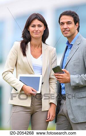 Businesswoman and businessman in business center. San Sebastian Technology Park. Donostia. Gipuzkoa. Basque Country. Spain. View Large Photo Image Stock Photo - Businesswoman and businessman in business center. San Sebastian Technology Park. Donostia. Gipuzkoa. Basque Country. Spain.. Fotosearch