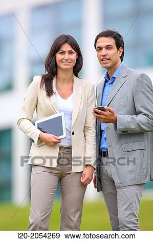 Businesswoman and businessman in business center. San Sebastian Technology Park. Donostia. Gipuzkoa. Basque Country. Spain. View Large Photo Image Stock Photo - Businesswoman and businessman in business center. San Sebastian Technology Park. Donostia. Gipuzkoa. Basque Country. Spain.. Fotosearch