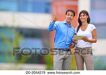 Businesswoman and businessman in business center. San Sebastian Technology Park. Donostia. Gipuzkoa. Basque Country. Spain. View Large Photo Image Stock Photo - Businesswoman and businessman in business center. San Sebastian Technology Park. Donostia. Gipuzkoa. Basque Country. Spain.. Fotosearch