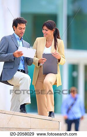 Businesswoman and businessman in business center. San Sebastian Technology Park. Donostia. Gipuzkoa. Basque Country. Spain. View Large Photo Image Stock Photo - Businesswoman and businessman in business center. San Sebastian Technology Park. Donostia. Gipuzkoa. Basque Country. Spain.. Fotosearch