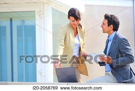 Businesswoman and businessman in business center. San Sebastian Technology Park. Donostia. Gipuzkoa. Basque Country. Spain. View Large Photo Image Stock Photo - Businesswoman and businessman in business center. San Sebastian Technology Park. Donostia. Gipuzkoa. Basque Country. Spain.. Fotosearch