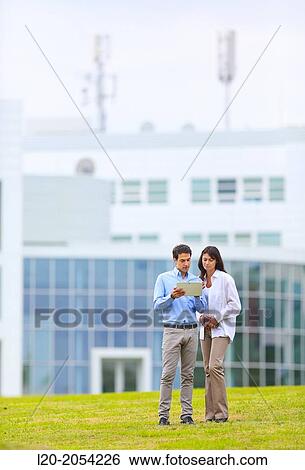 Businesswoman and businessman in business center. San Sebastian Technology Park. Donostia. Gipuzkoa. Basque Country. Spain. View Large Photo Image Stock Photograph - Businesswoman and businessman in business center. San Sebastian Technology Park. Donostia. Gipuzkoa. Basque Country. Spain.. Fotosearch