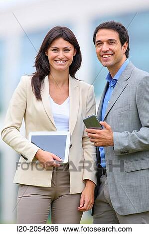 Businesswoman and businessman in business center. San Sebastian Technology Park. Donostia. Gipuzkoa. Basque Country. Spain. View Large Photo Image Stock Photograph - Businesswoman and businessman in business center. San Sebastian Technology Park. Donostia. Gipuzkoa. Basque Country. Spain.. Fotosearch