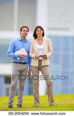 Businesswoman and businessman in business center. San Sebastian Technology Park. Donostia. Gipuzkoa. Basque Country. Spain. View Large Photo Image Stock Photography - Businesswoman and businessman in business center. San Sebastian Technology Park. Donostia. Gipuzkoa. Basque Country. Spain.. Fotosearch