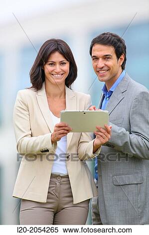 Businesswoman and businessman in business center. San Sebastian Technology Park. Donostia. Gipuzkoa. Basque Country. Spain. View Large Photo Image Stock Photography - Businesswoman and businessman in business center. San Sebastian Technology Park. Donostia. Gipuzkoa. Basque Country. Spain.. Fotosearch