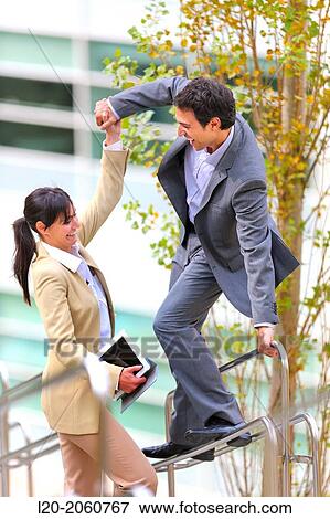 Businesswoman and businessman jumping on stairs. business center. San Sebastian Technology Park. Donostia. Gipuzkoa. Basque Country. Spain. View Large Photo Image Stock Photo - Businesswoman and businessman jumping on stairs. business center. San Sebastian Technology Park. Donostia. Gipuzkoa. Basque Country. Spain.. Fotosearch