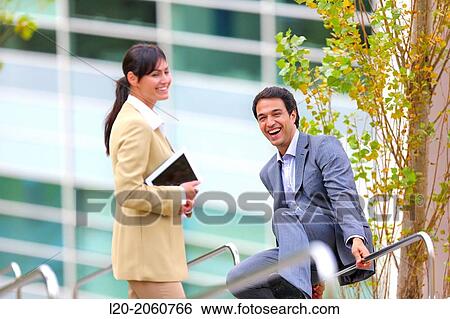 Businesswoman and businessman jumping on stairs. business center. San Sebastian Technology Park. Donostia. Gipuzkoa. Basque Country. Spain. View Large Photo Image Stock Photograph - Businesswoman and businessman jumping on stairs. business center. San Sebastian Technology Park. Donostia. Gipuzkoa. Basque Country. Spain.. Fotosearch