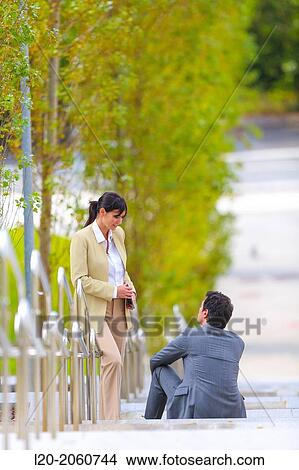 Businesswoman and businessman talking on stairs. business center. San Sebastian Technology Park. Donostia. Gipuzkoa. Basque Country. Spain. View Large Photo Image Picture - Businesswoman and businessman talking on stairs. business center. San Sebastian Technology Park. Donostia. Gipuzkoa. Basque Country. Spain.. Fotosearch