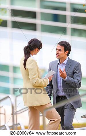 Businesswoman and businessman talking on stairs. business center. San Sebastian Technology Park. Donostia. Gipuzkoa. Basque Country. Spain. View Large Photo Image Picture - Businesswoman and businessman talking on stairs. business center. San Sebastian Technology Park. Donostia. Gipuzkoa. Basque Country. Spain.. Fotosearch