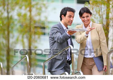 Businesswoman and businessman talking on stairs. business center. San Sebastian Technology Park. Donostia. Gipuzkoa. Basque Country. Spain. View Large Photo Image Stock Image - Businesswoman and businessman talking on stairs. business center. San Sebastian Technology Park. Donostia. Gipuzkoa. Basque Country. Spain.. Fotosearch