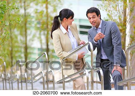 Businesswoman and businessman talking on stairs. business center. San Sebastian Technology Park. Donostia. Gipuzkoa. Basque Country. Spain. View Large Photo Image Stock Image - Businesswoman and businessman talking on stairs. business center. San Sebastian Technology Park. Donostia. Gipuzkoa. Basque Country. Spain.. Fotosearch