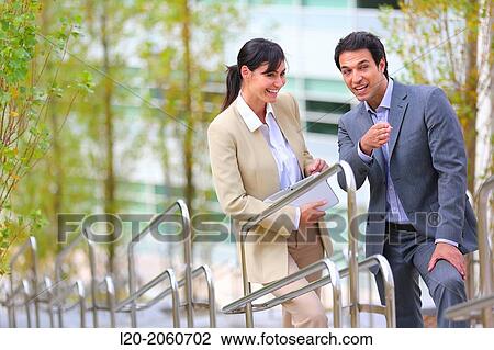 Businesswoman and businessman talking on stairs. business center. San Sebastian Technology Park. Donostia. Gipuzkoa. Basque Country. Spain. View Large Photo Image Stock Image - Businesswoman and businessman talking on stairs. business center. San Sebastian Technology Park. Donostia. Gipuzkoa. Basque Country. Spain.. Fotosearch