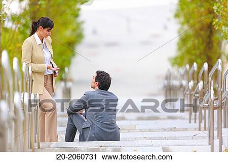 Businesswoman and businessman talking on stairs. business center. San Sebastian Technology Park. Donostia. Gipuzkoa. Basque Country. Spain. View Large Photo Image Stock Image - Businesswoman and businessman talking on stairs. business center. San Sebastian Technology Park. Donostia. Gipuzkoa. Basque Country. Spain.. Fotosearch