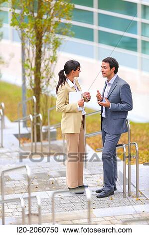 Businesswoman and businessman talking on stairs. business center. San Sebastian Technology Park. Donostia. Gipuzkoa. Basque Country. Spain. View Large Photo Image Stock Image - Businesswoman and businessman talking on stairs. business center. San Sebastian Technology Park. Donostia. Gipuzkoa. Basque Country. Spain.. Fotosearch