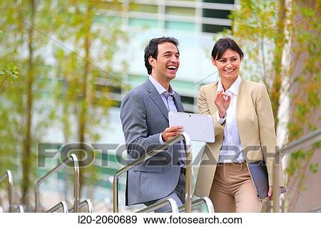 Businesswoman and businessman talking on stairs. business center. San Sebastian Technology Park. Donostia. Gipuzkoa. Basque Country. Spain. View Large Photo Image Stock Photo - Businesswoman and businessman talking on stairs. business center. San Sebastian Technology Park. Donostia. Gipuzkoa. Basque Country. Spain.. Fotosearch