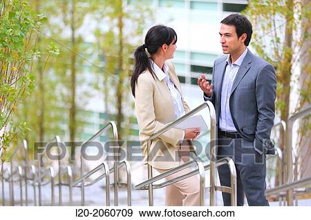 Businesswoman and businessman talking on stairs. business center. San Sebastian Technology Park. Donostia. Gipuzkoa. Basque Country. Spain. View Large Photo Image Stock Photo - Businesswoman and businessman talking on stairs. business center. San Sebastian Technology Park. Donostia. Gipuzkoa. Basque Country. Spain.. Fotosearch