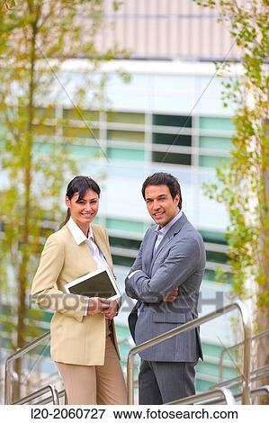Businesswoman and businessman talking on stairs. business center. San Sebastian Technology Park. Donostia. Gipuzkoa. Basque Country. Spain. View Large Photo Image Stock Photo - Businesswoman and businessman talking on stairs. business center. San Sebastian Technology Park. Donostia. Gipuzkoa. Basque Country. Spain.. Fotosearch