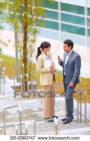 Businesswoman and businessman talking on stairs. business center. San Sebastian Technology Park. Donostia. Gipuzkoa. Basque Country. Spain. View Large Photo Image Stock Photo - Businesswoman and businessman talking on stairs. business center. San Sebastian Technology Park. Donostia. Gipuzkoa. Basque Country. Spain.. Fotosearch