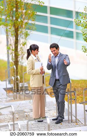 Businesswoman and businessman talking on stairs. business center. San Sebastian Technology Park. Donostia. Gipuzkoa. Basque Country. Spain. View Large Photo Image Stock Photo - Businesswoman and businessman talking on stairs. business center. San Sebastian Technology Park. Donostia. Gipuzkoa. Basque Country. Spain.. Fotosearch