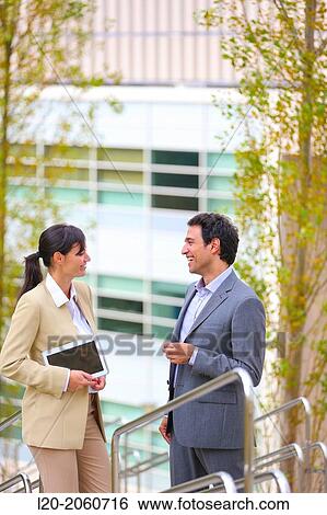 Businesswoman and businessman talking on stairs. business center. San Sebastian Technology Park. Donostia. Gipuzkoa. Basque Country. Spain. View Large Photo Image Stock Photograph - Businesswoman and businessman talking on stairs. business center. San Sebastian Technology Park. Donostia. Gipuzkoa. Basque Country. Spain.. Fotosearch