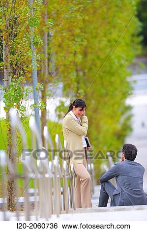 Businesswoman and businessman talking on stairs. business center. San Sebastian Technology Park. Donostia. Gipuzkoa. Basque Country. Spain. View Large Photo Image Stock Photograph - Businesswoman and businessman talking on stairs. business center. San Sebastian Technology Park. Donostia. Gipuzkoa. Basque Country. Spain.. Fotosearch
