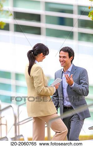 Businesswoman and businessman talking on stairs. business center. San Sebastian Technology Park. Donostia. Gipuzkoa. Basque Country. Spain. View Large Photo Image Stock Photography - Businesswoman and businessman talking on stairs. business center. San Sebastian Technology Park. Donostia. Gipuzkoa. Basque Country. Spain.. Fotosearch