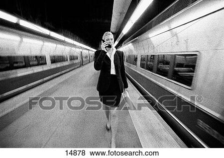 Businesswoman at train station View Large Photo Image Stock Photo - Businesswoman at train station. Fotosearch