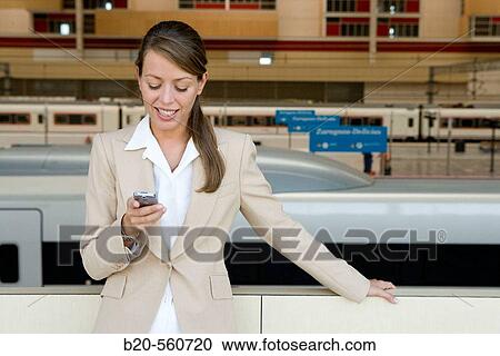 Businesswoman. AVE, Tren Alta Velocidad. Delicias station, Zaragoza, Arag? n. Spain. View Large Photo Image Stock Image - Businesswoman. AVE, Tren Alta Velocidad. Delicias station, Zaragoza, Arag? n. Spain.. Fotosearch