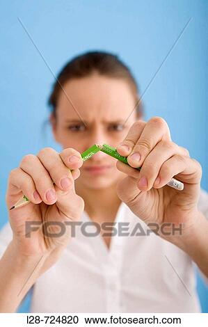 Businesswoman breaking pencil View Large Photo Image Stock Image - Businesswoman breaking pencil. Fotosearch