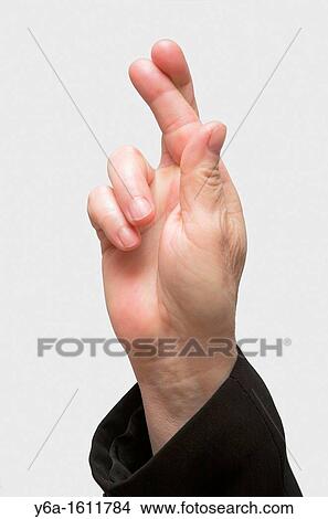 Businesswoman hand with fingers crossed, close-up View Large Photo Image Picture - Businesswoman hand with fingers crossed, close-up. Fotosearch