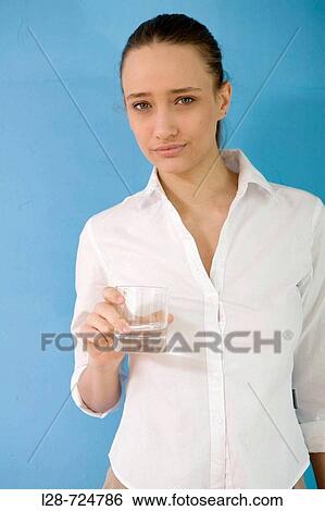 businesswoman holding a glass of water View Large Photo Image Stock Photograph - businesswoman holding a glass of water. Fotosearch