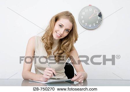 businesswoman holding a pen View Large Photo Image Stock Image - businesswoman holding a pen. Fotosearch